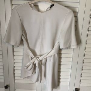 Asymmetrical blouse with front tie